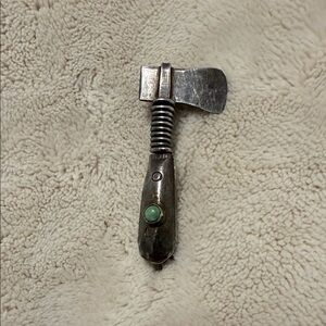 Brooch native American Sterling silver tomahawk with turquoise stone
